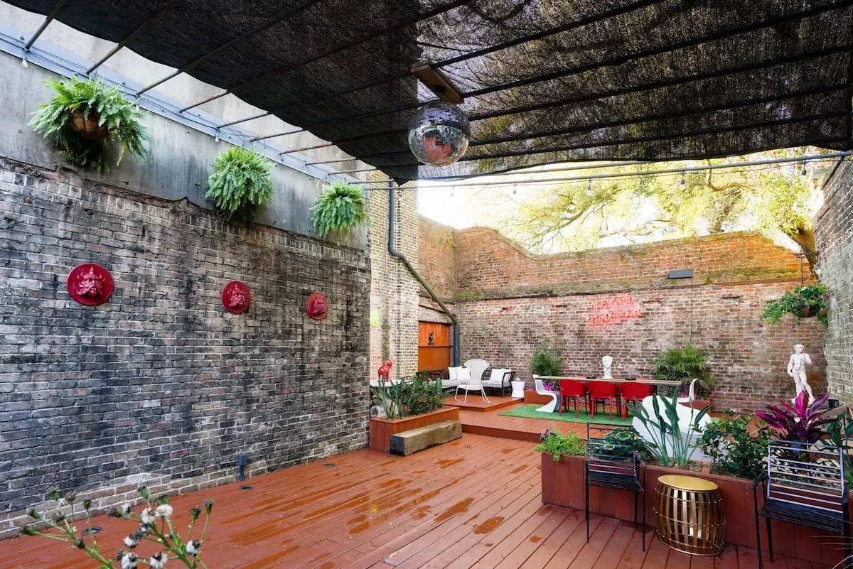 backyard with neon sign in new orleans